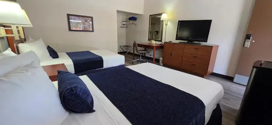 Hotel room with two beds and a flat screen tv