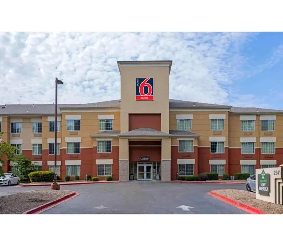 Hotel with a sign on the front of a building