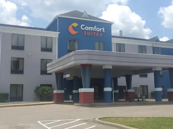 Hotel with a sign on the front of a building