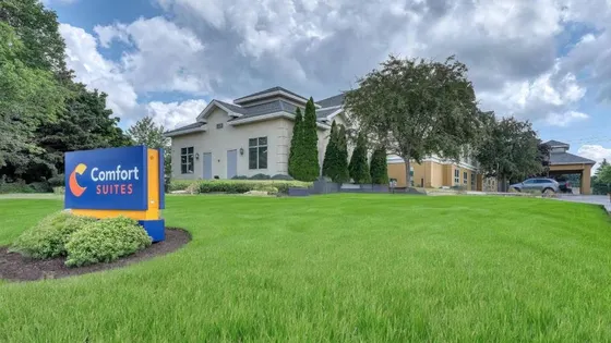 House with a sign in front of a yard