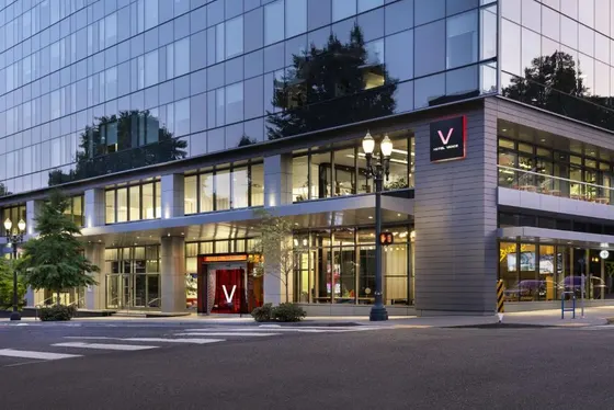 Large building with a sign in front of it