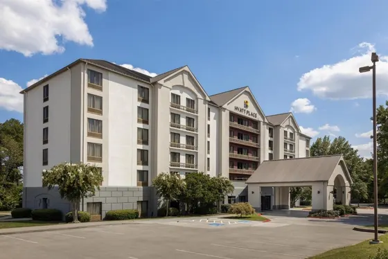 Rendering of a hotel with a parking lot