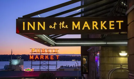 Sign that reads inn of the market on a building