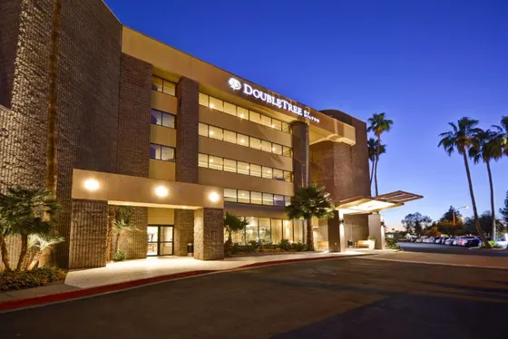 Hotel with a sign on the front of it