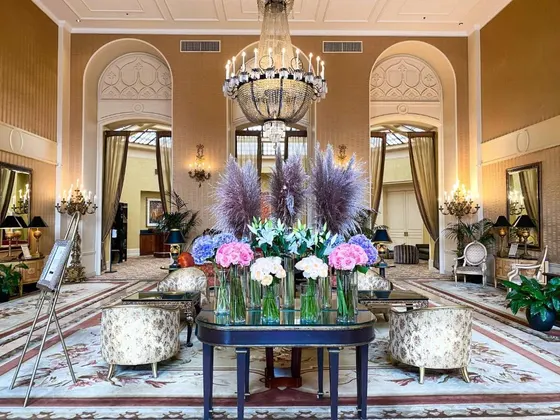 Lobby with a table with flowers on it