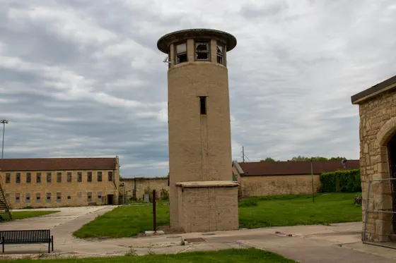 Guard tower at the Old Joliet Prison beneath a cloudy sky