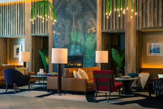 Lobby with a couch and tables and chairs