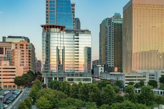 City skyline with many tall buildings and cars