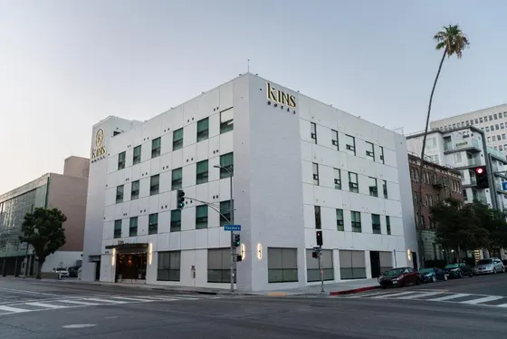 White building on the corner of a city street