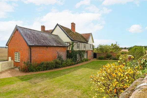Knights Farm farmhouse exterior with lawn and garden