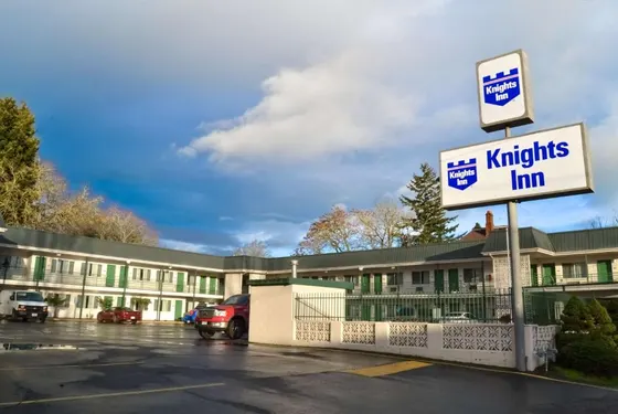 Kirkleys inn sign in front of a parking lot