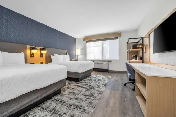 Hotel room with two beds and a flat screen tv