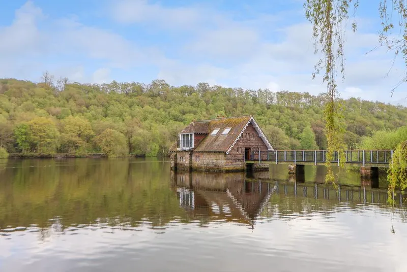 Lady Of The Lake boathouse on Rudyard Lake with reflection