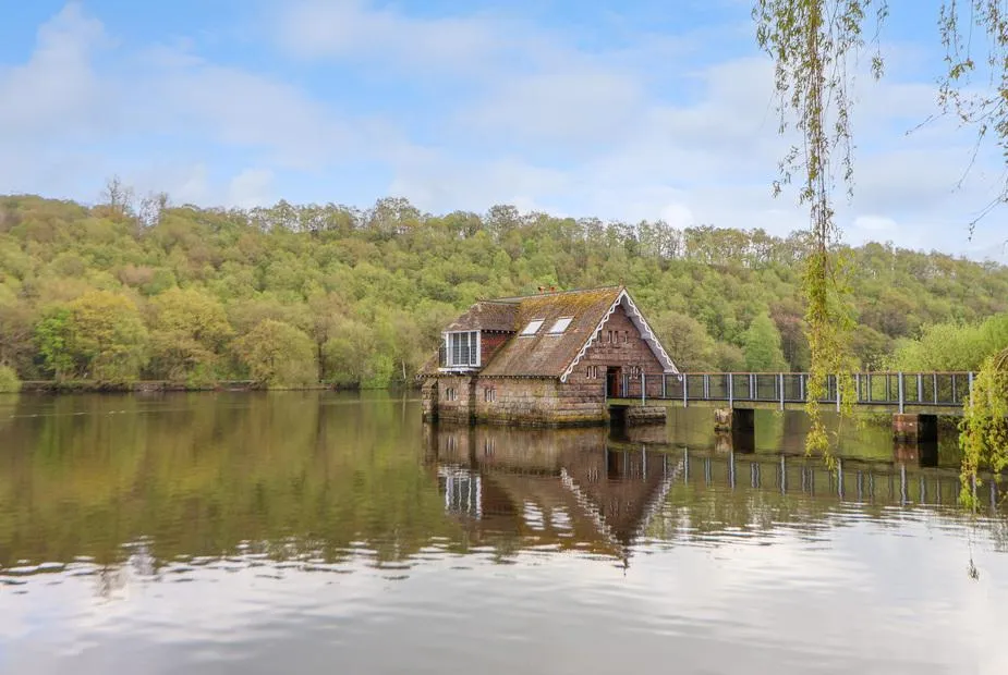 Lady Of The Lake boathouse on Rudyard Lake with reflection