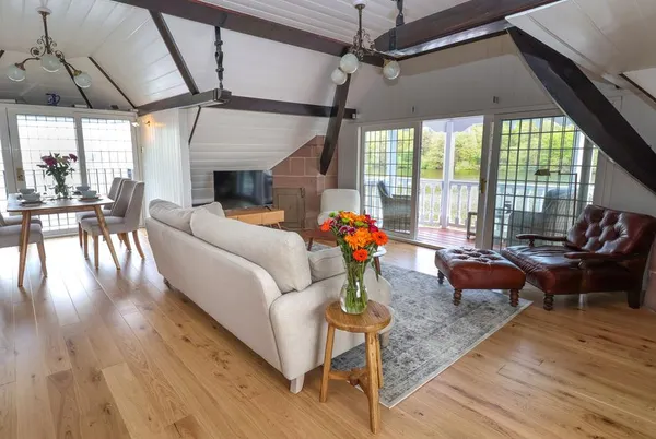 Lady Of The Lake open-plan living with exposed beams and lake views