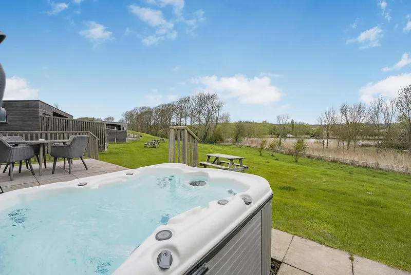 Lakeview Retreat hot tub overlooking countryside and lake