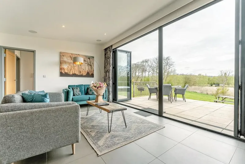 Lakeview Retreat living room with open bifold doors to countryside