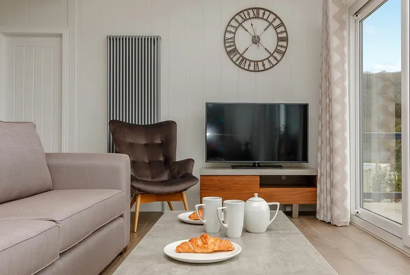 Langford Premier living room with accent chair and styled coffee table