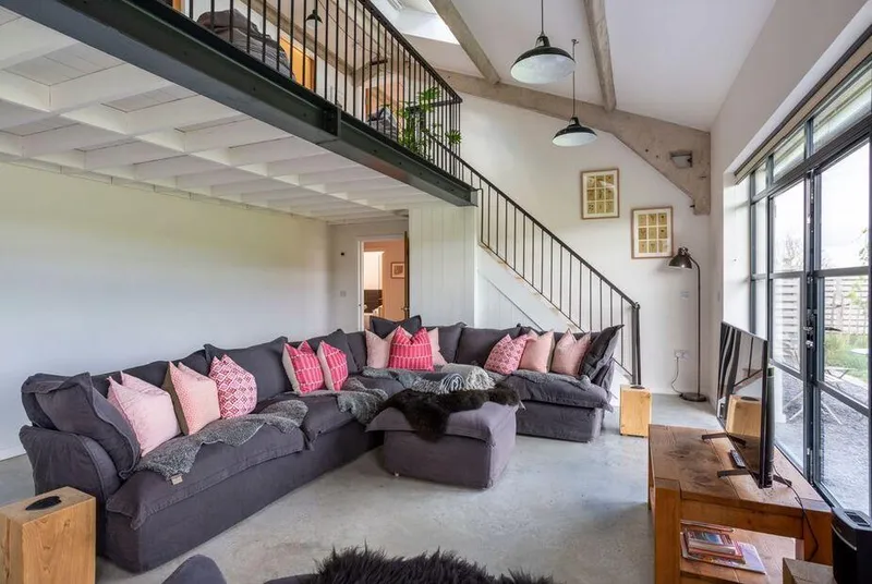 Oakwood Barn double-height living room with mezzanine and vaulted ceiling