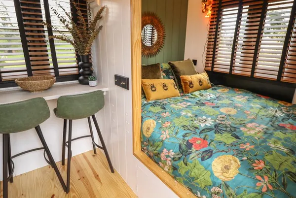 Limetree Luxury Glamping Southdown floral bed nook beside breakfast bar