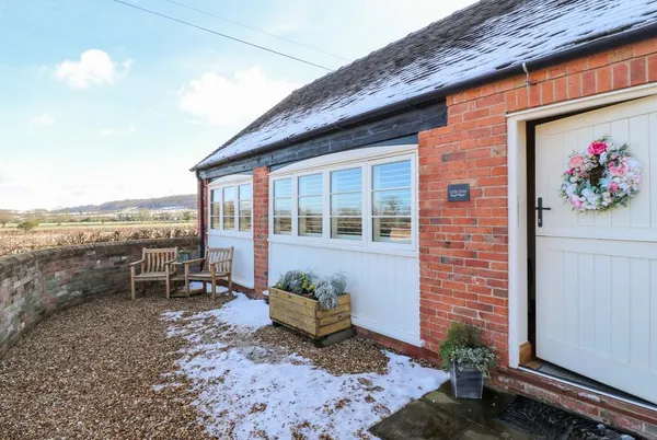 Little Gem side entrance with countryside views and courtyard