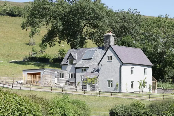 Lower Hodre farmhouse exterior on the hillside