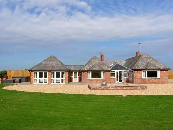 Lower Lodge wide exterior view across the lawn
