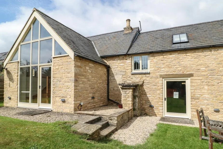 Malt Barn stone barn exterior with full-height glazed gable