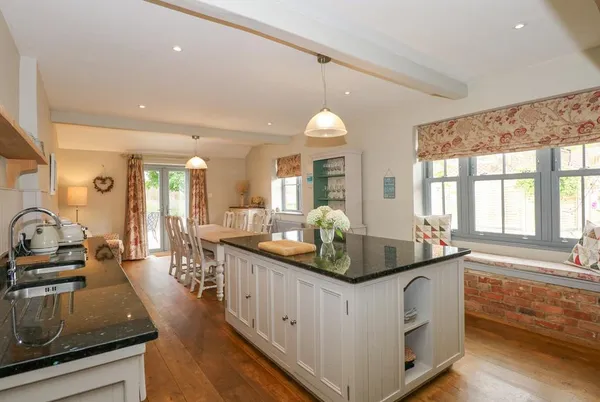 Malthouse Farm open-plan kitchen-diner with granite island and oak floors