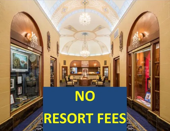 Building with a sign that says no resort fees