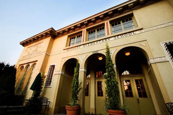 University school with plants in front of a building