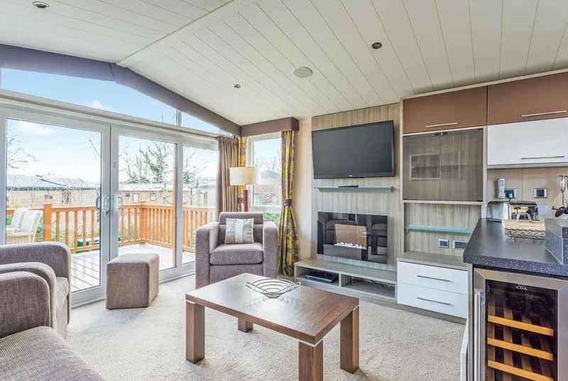 Mendip Premier 2 open-plan living room with vaulted ceiling and patio doors