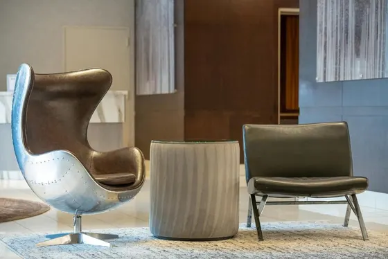 Two chairs and a chair in a room