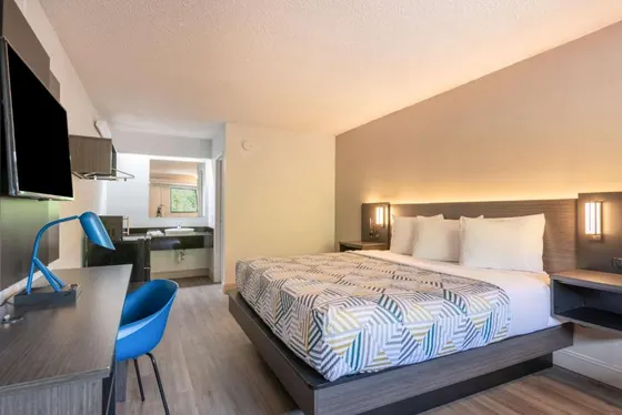 Hotel room with a bed and a desk