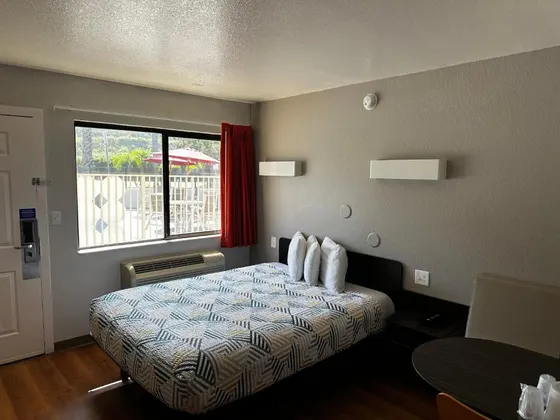 Bedroom with a bed and a window