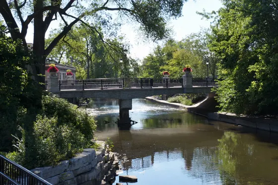 Flower-lined bridge over the DuPage River on the Naperville Riverwalk