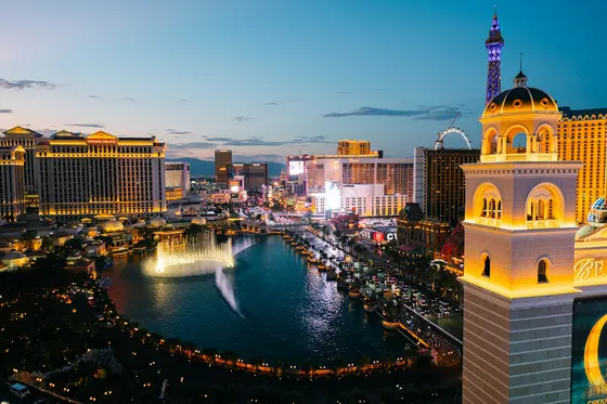 Bellagio fountains and illuminated Las Vegas Strip at dusk