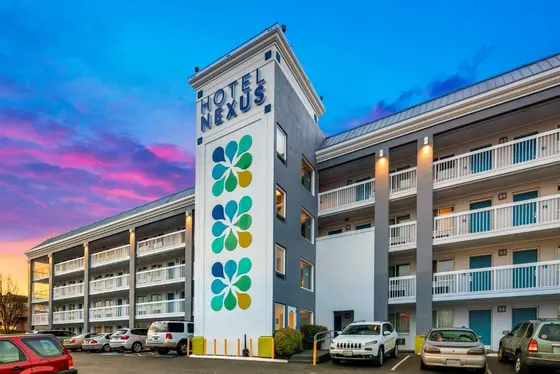 Hotel with a sign on the side of a building