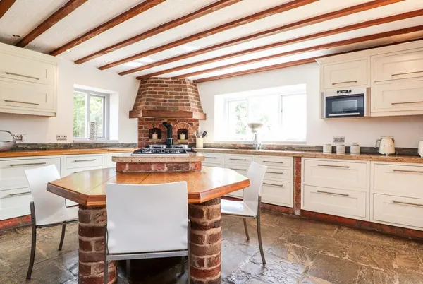 Noahs Barn bright farmhouse kitchen with exposed beams