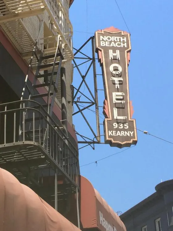 Sign for a north beach motel on a building