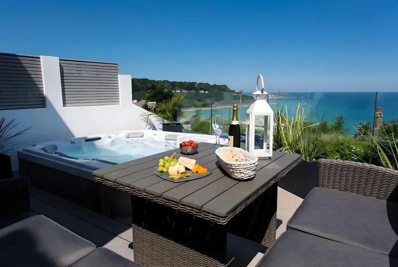 One Atlantic Watch terrace dining beside hot tub overlooking St Ives Bay