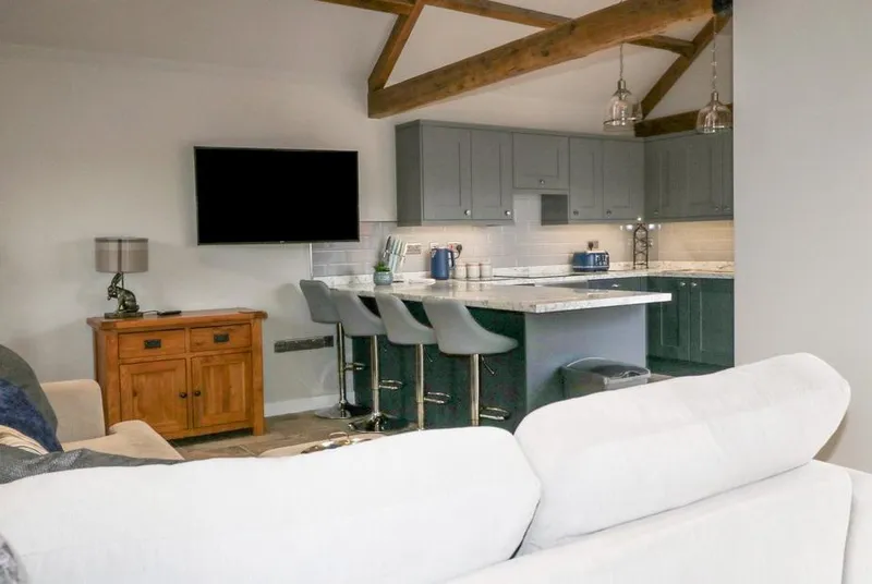 Owl View open-plan kitchen-diner with vaulted oak beams