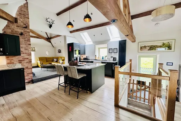 Parlour Barn open-plan kitchen-living with vaulted oak beams and skylights