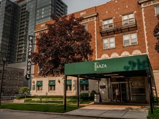 Building with a green awning in front of it