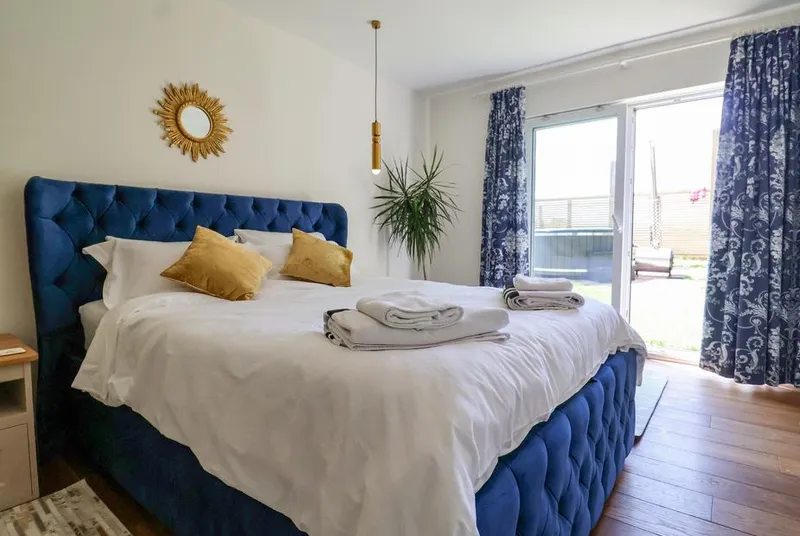 Polly's Annexe four-poster bedroom with countryside view