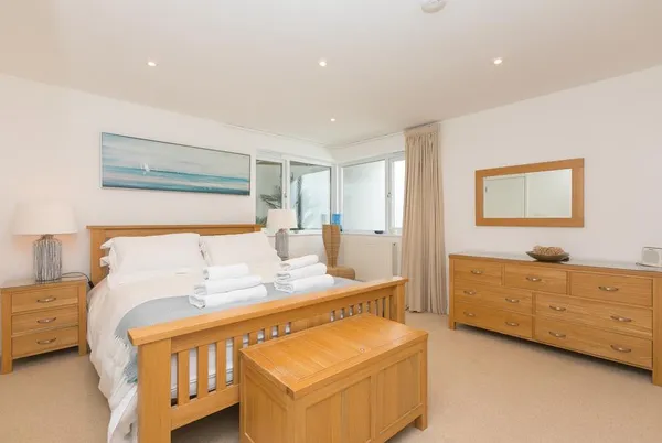Portside bedroom with pale wood furniture