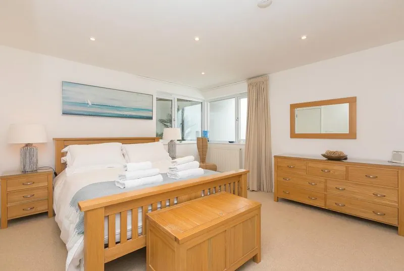 Portside bedroom with pale wood furniture