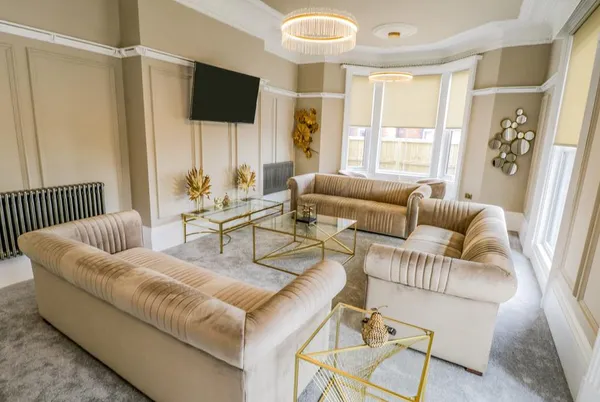Railway House Ladies Lounge with gold velvet sofas, wall panelling and chandelier