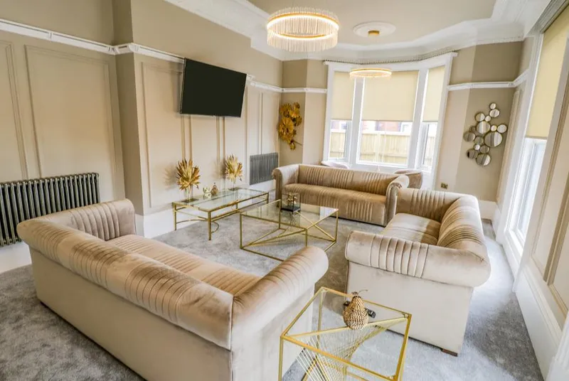 Railway House Ladies Lounge with gold velvet sofas, wall panelling and chandelier