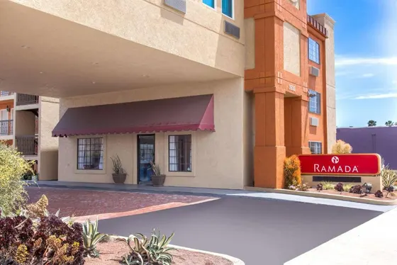 Hotel with a sign in front of a building